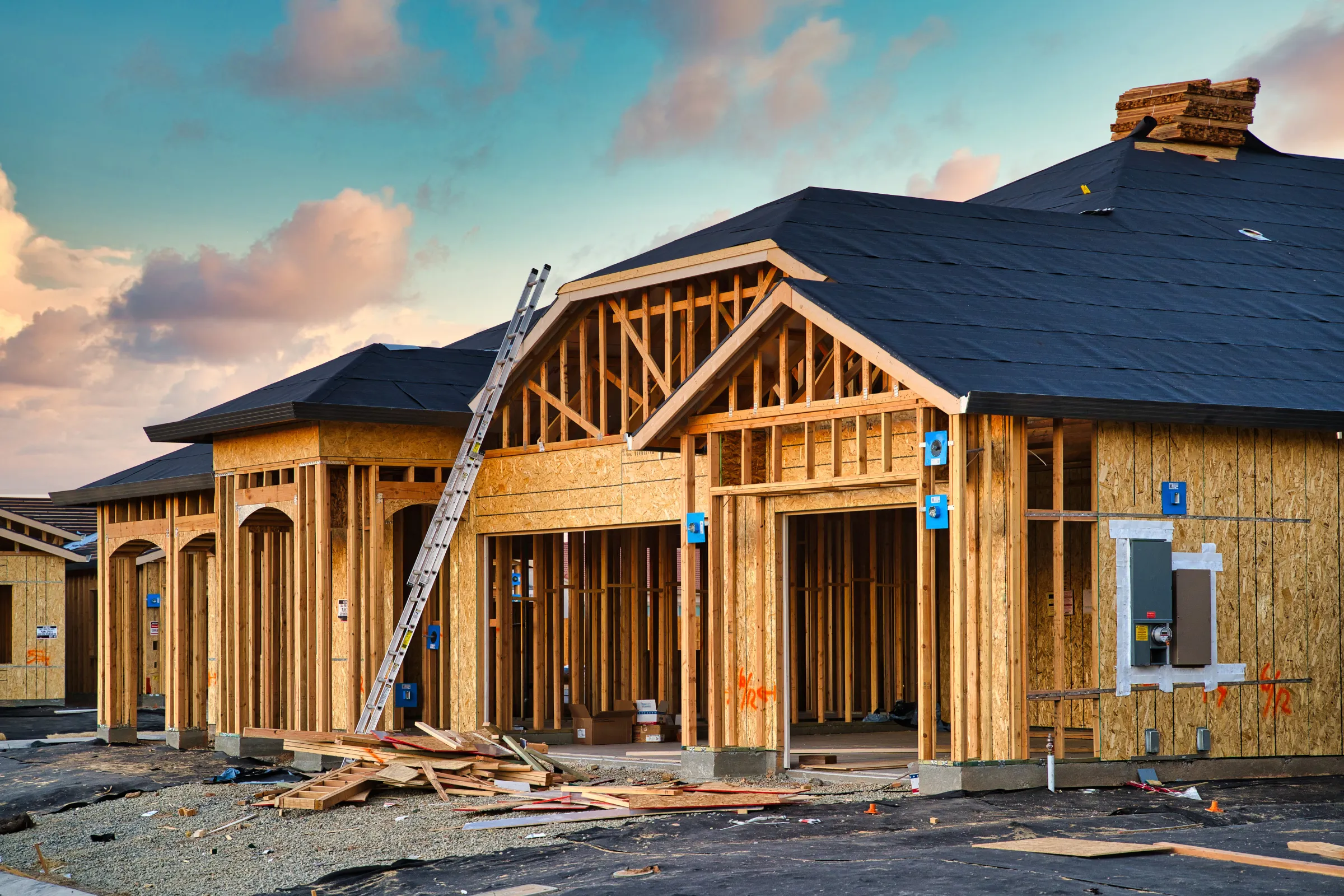 New home construction in Los Angeles with wood framing and roof installation during residential building work